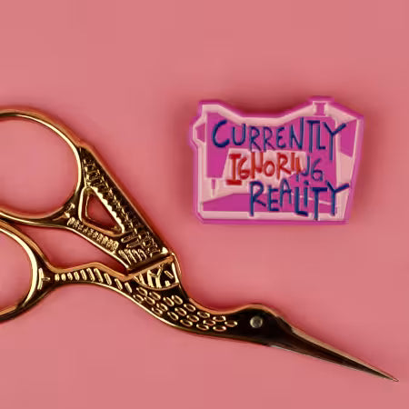 Currently Ignoring Reality Enamel Needle Minder - KC419